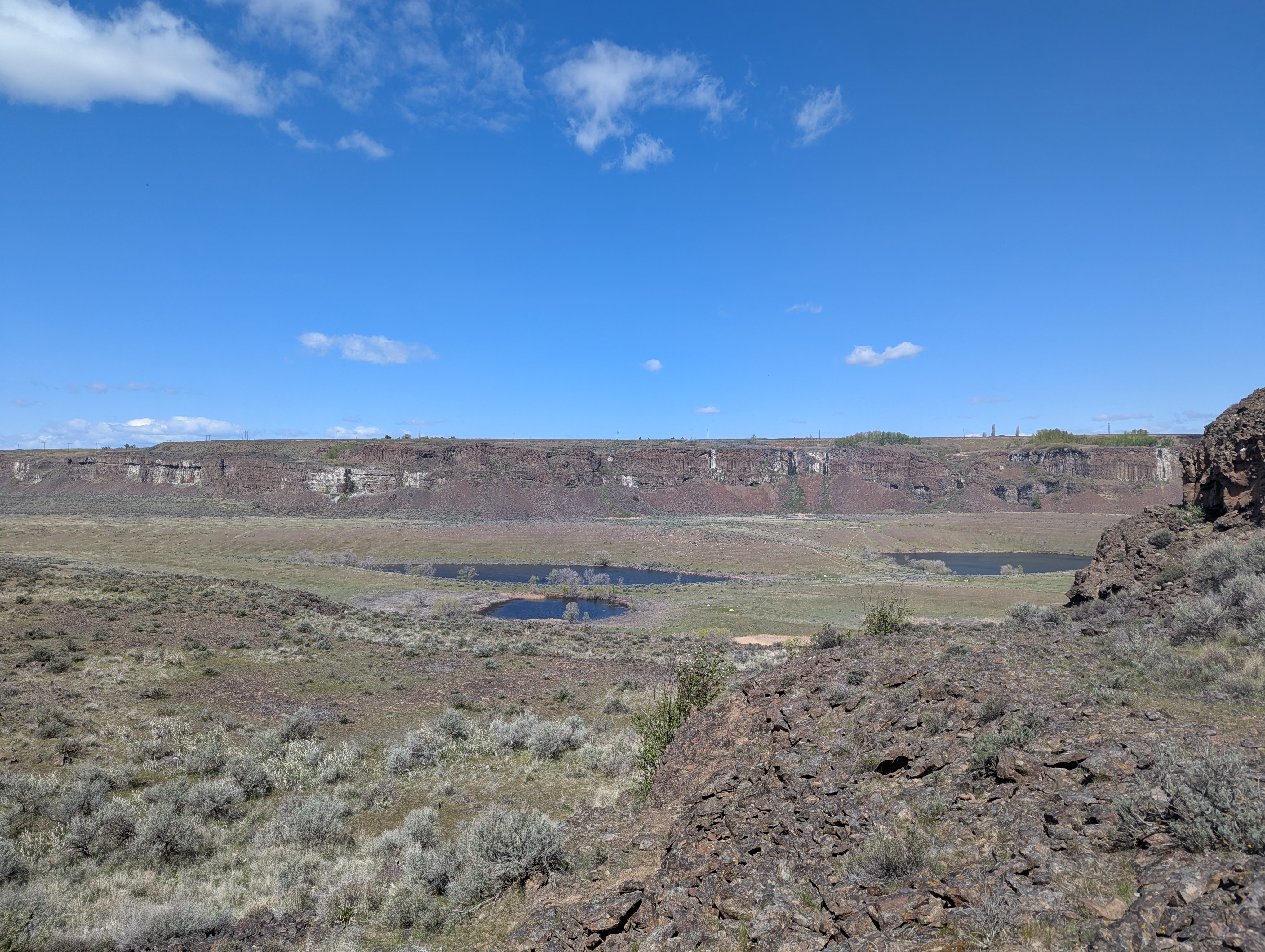 A view from a ridge looking across three lakes