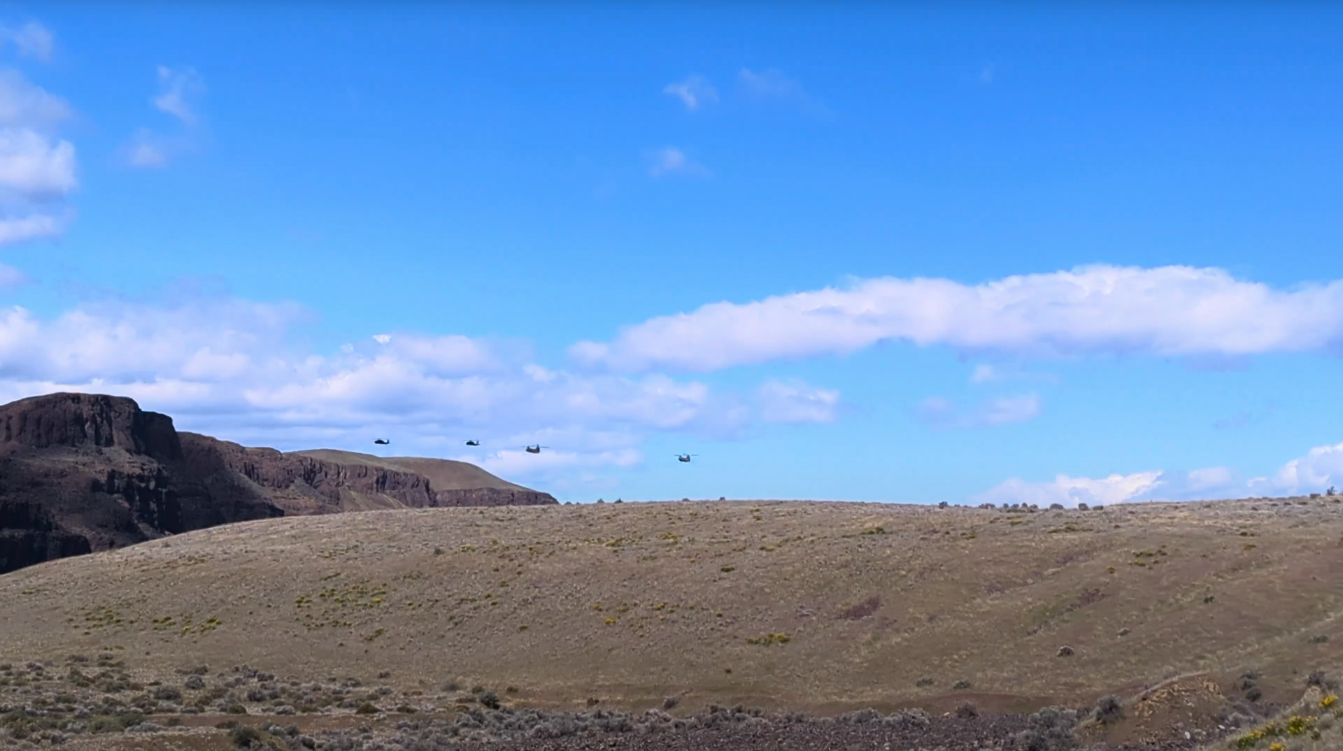 Four helicopters in the distance