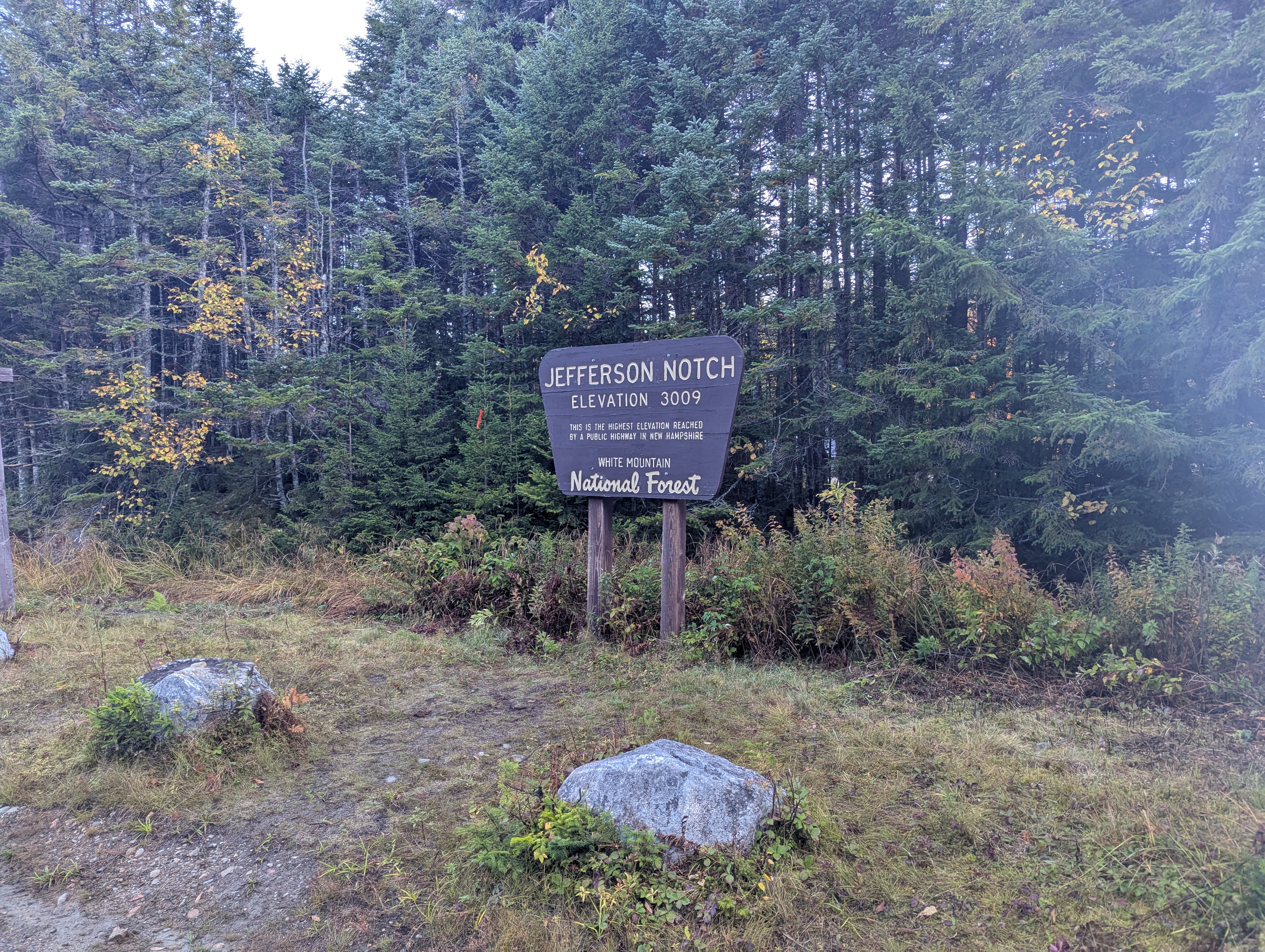 The sign for Jefferson Notch, which reads 'Elevation 3009. This is the highest elevation reached by a public highway in New Hampshire'